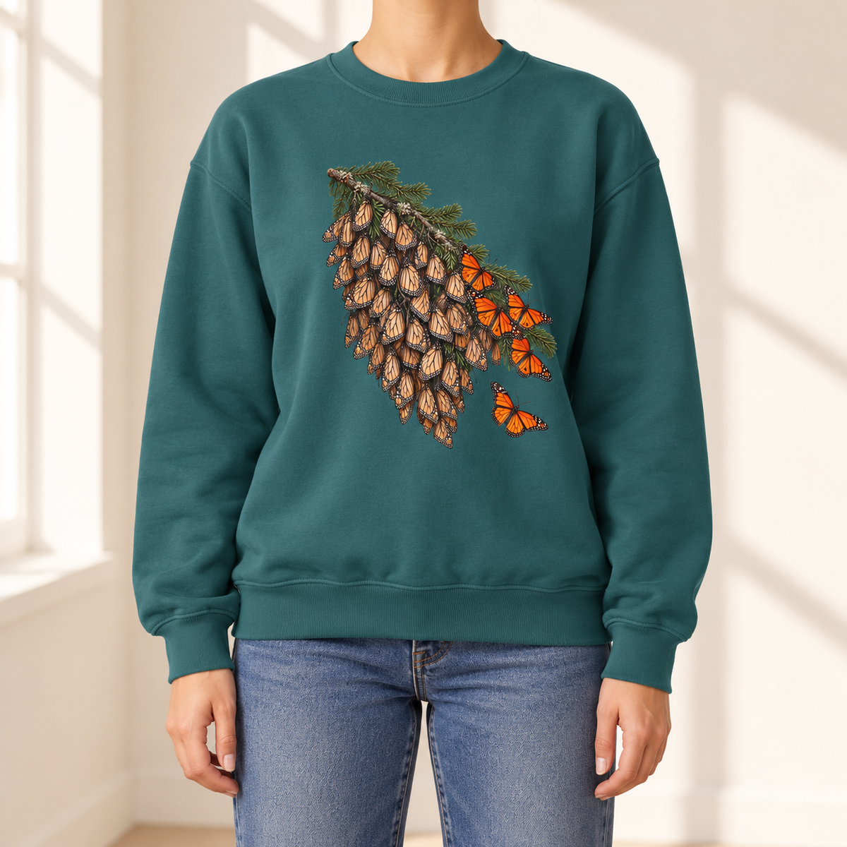 Overwintering Monarchs Sweatshirt — a winter roost of monarch butterflies on a fir bough