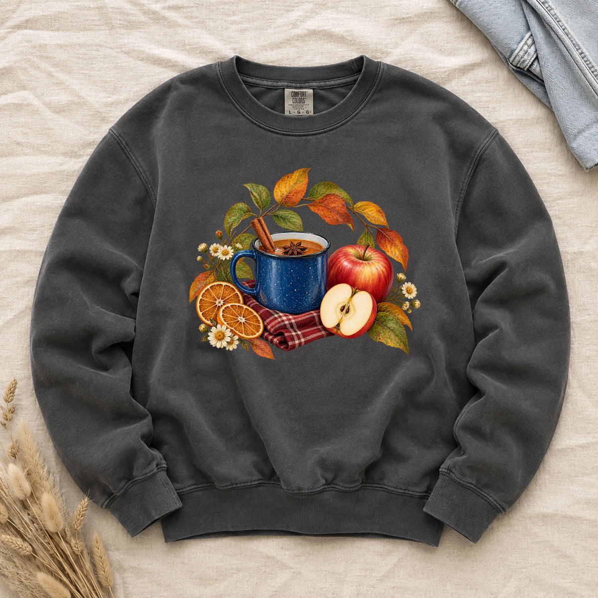 The Cider Can Wait sweatshirt in Pepper, a spiced apple cider still life with golden fruit on soft charcoal