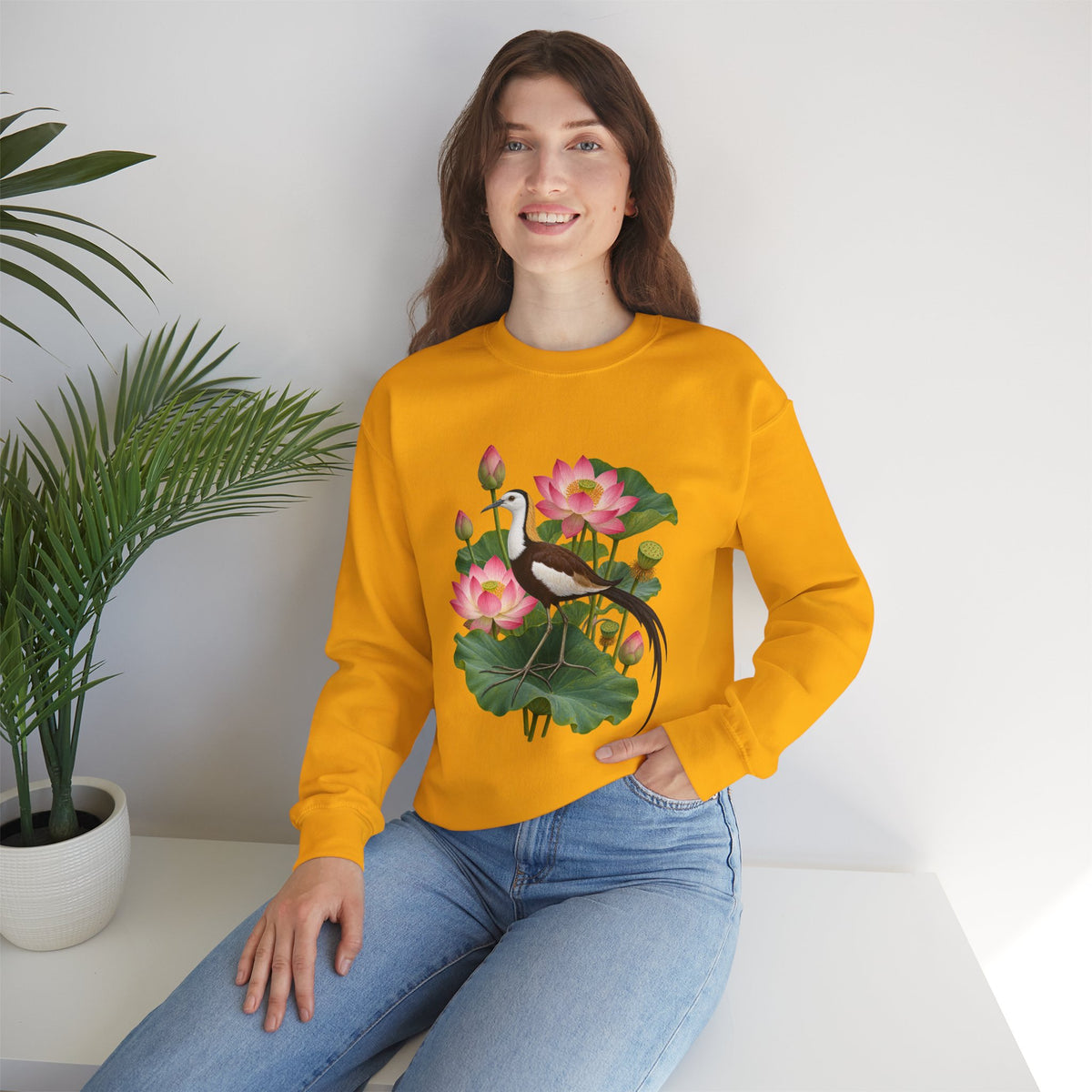 Lightly, She Goes crewneck sweatshirt, a long-tailed waterbird among pink lotus blossoms, buds, seed pods and broad green leaves, image 12 of 28