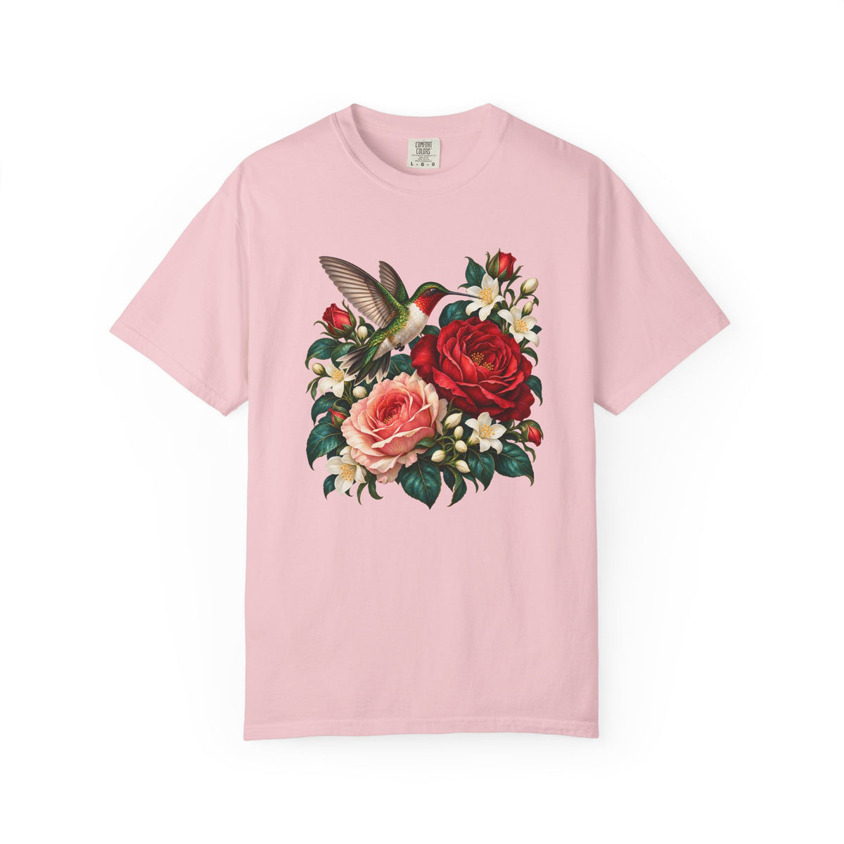 A male ruby-throated hummingbird with an iridescent green back and red throat, hovering at red and blush roses on a Comfort Colors garment-dyed tee