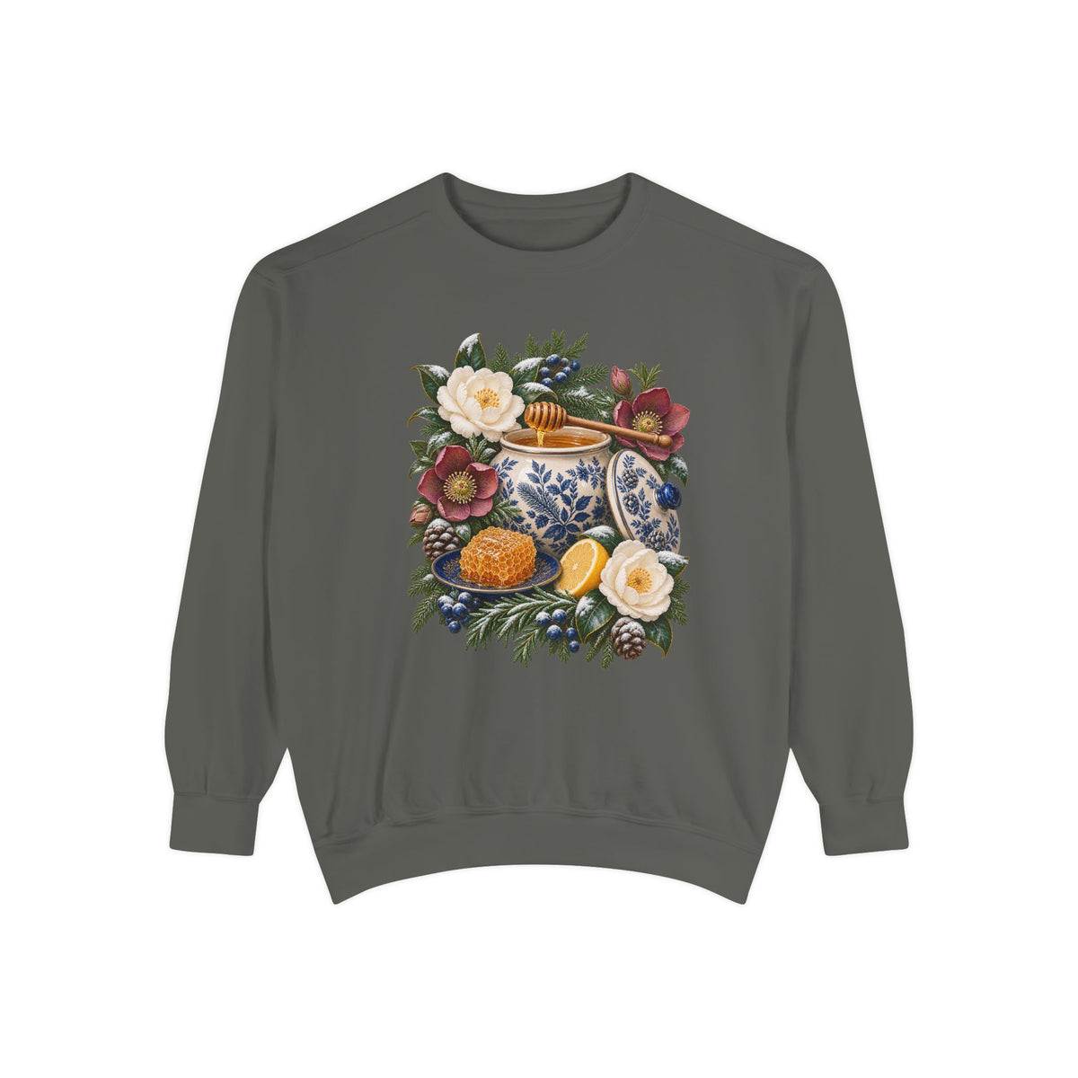 Cream and cobalt transferware jar illustration on a 9.5 oz garment-dyed cotton-blend crewneck pullover — a cream and cobalt transferware jar of honey with a wooden dipper, honeycomb on a blue plate and a cut lemon among winter florals