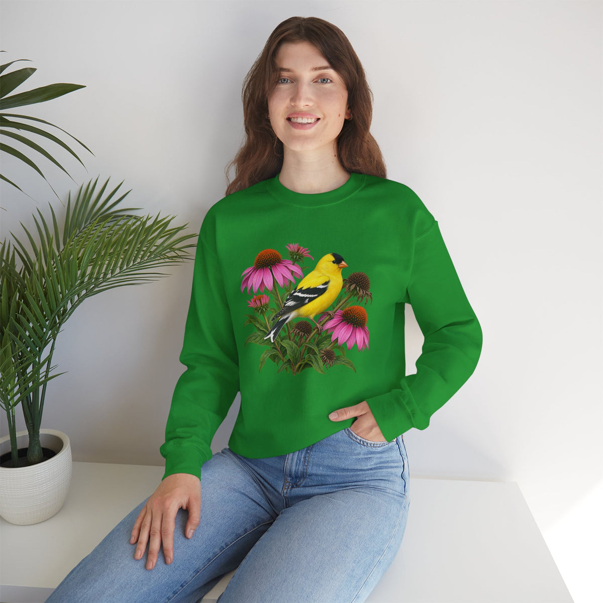 A Small Bright Thing crewneck sweatshirt, a golden-yellow American goldfinch among pink coneflowers, seed heads and green leaves, image 16 of 22