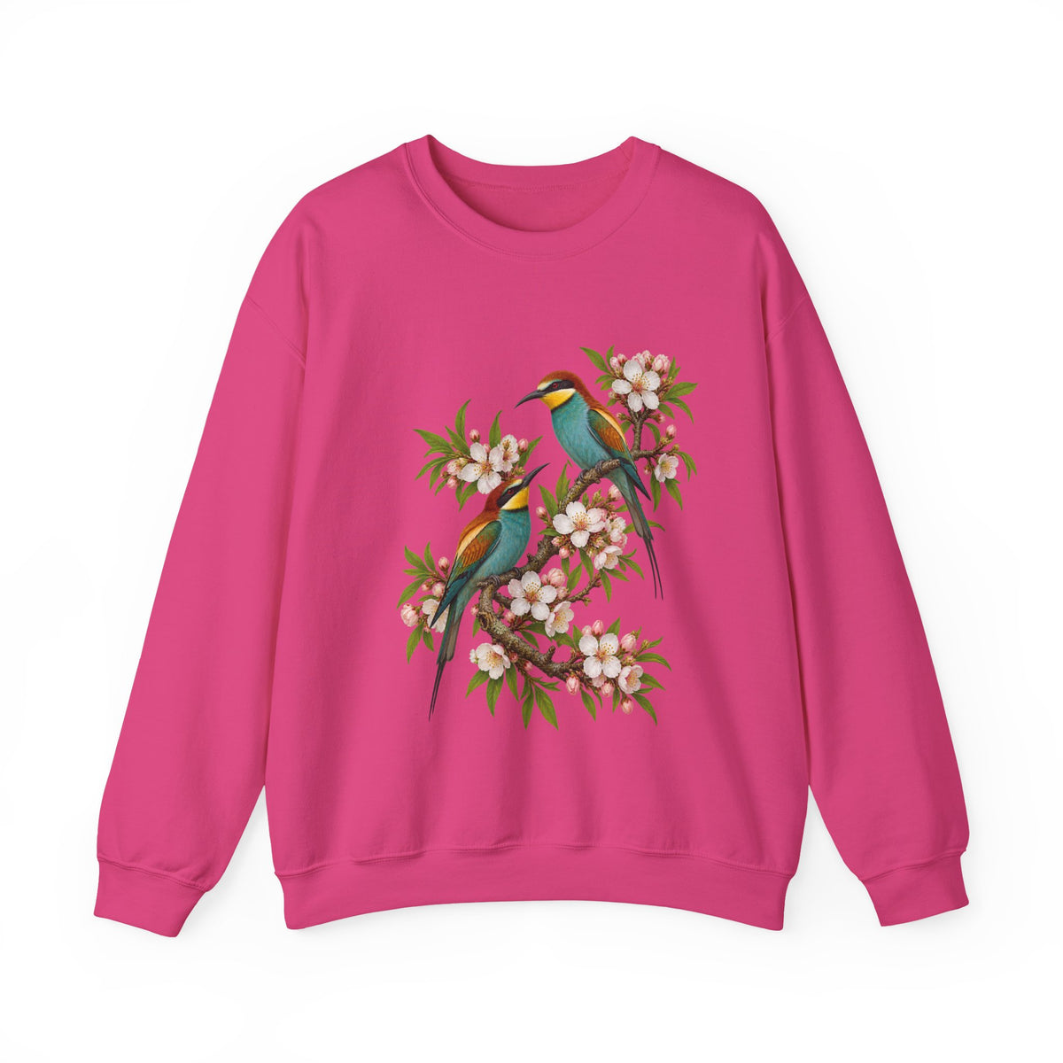 The Scenic Way Home sweatshirt — two birds with teal, golden-yellow and rust plumage perched among cream and blush blossoms, on a unisex crewneck