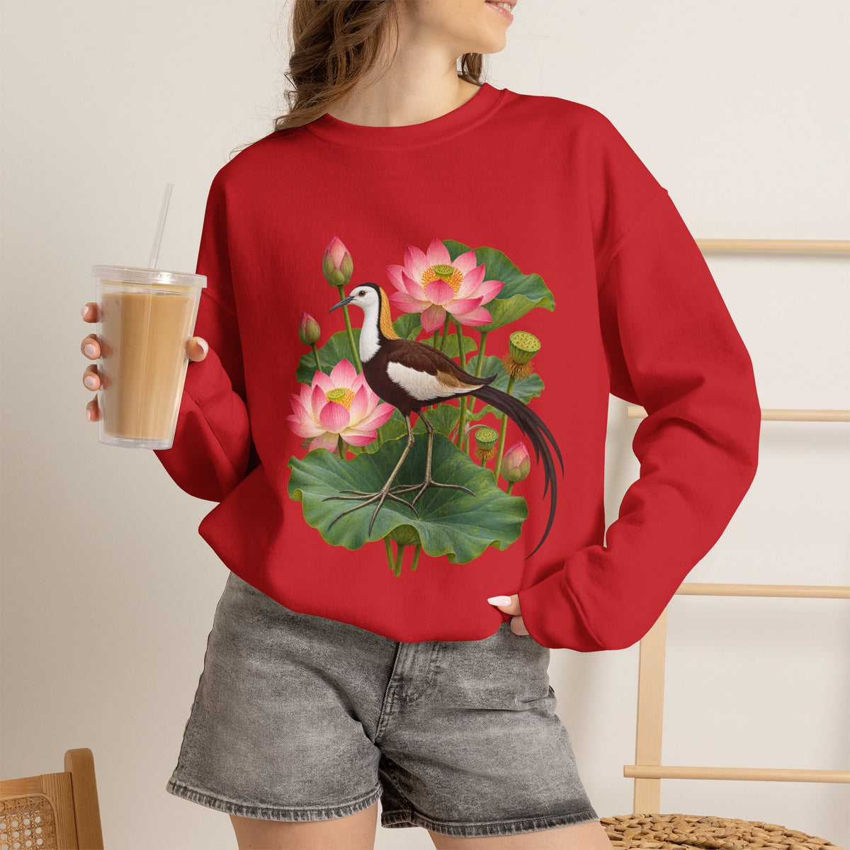 Lightly, She Goes crewneck sweatshirt, a long-tailed waterbird among pink lotus blossoms, buds, seed pods and broad green leaves, image 28 of 28
