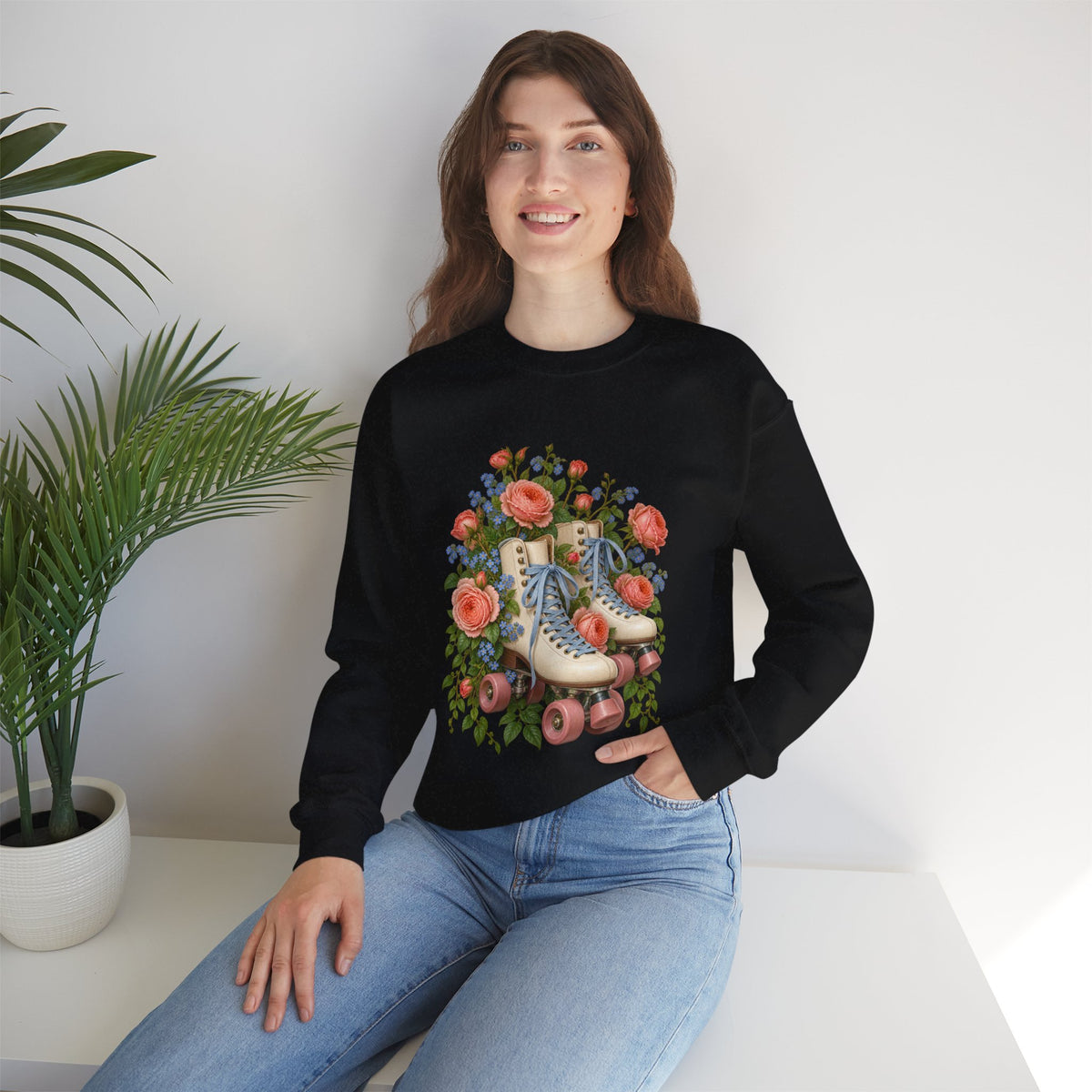 She Still Rolls crewneck sweatshirt, cream roller skates with blue laces and dusty pink wheels among coral roses, small blue flowers and trailing greenery, image 9 of 21