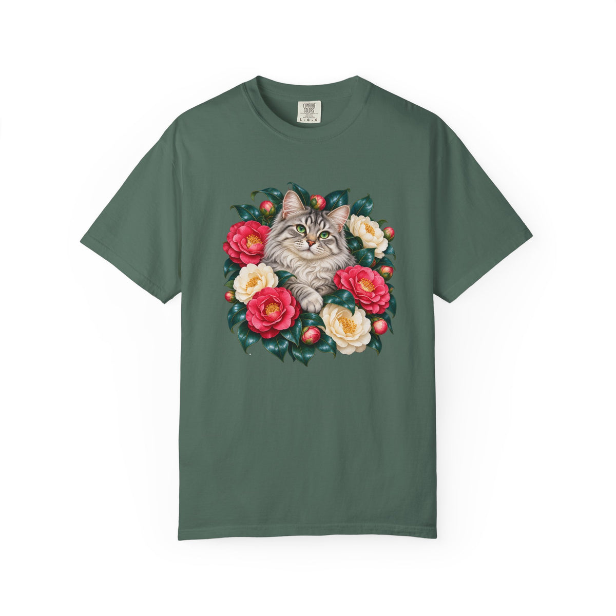 Winter wreath of pink and cream camellias with evergreen leaves and red berries around a silver tabby cat, on a Comfort Colors garment-dyed tee