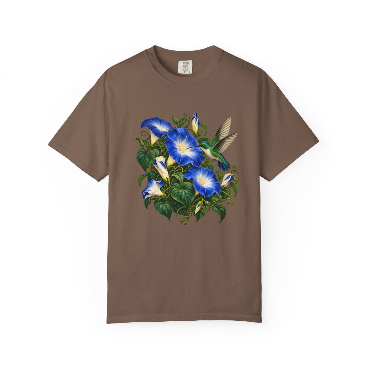The hummingbird at the top of the morning glory vine — iridescent emerald crown and back, white throat and breast, wings raised in a hover, on a garment-dyed Comfort Colors 1717 tee
