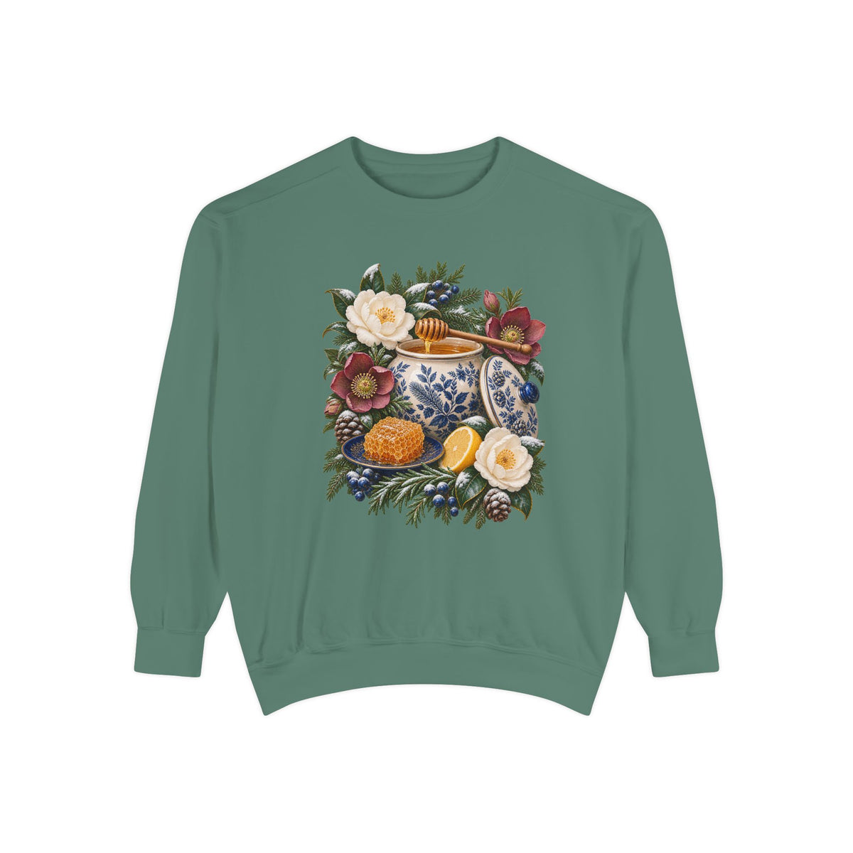 Blue and white winter botanical design on soft-washed garment-dyed Comfort Colors fleece — a cream and cobalt transferware jar of honey with a wooden dipper, honeycomb on a blue plate and a cut lemon among winter florals