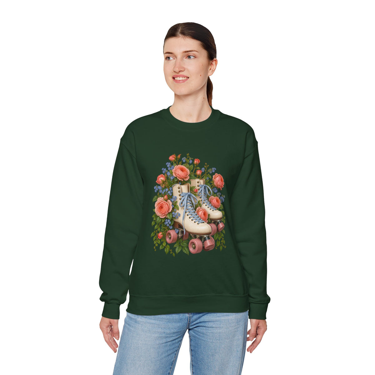 She Still Rolls crewneck sweatshirt, cream roller skates with blue laces and dusty pink wheels among coral roses, small blue flowers and trailing greenery, image 18 of 21