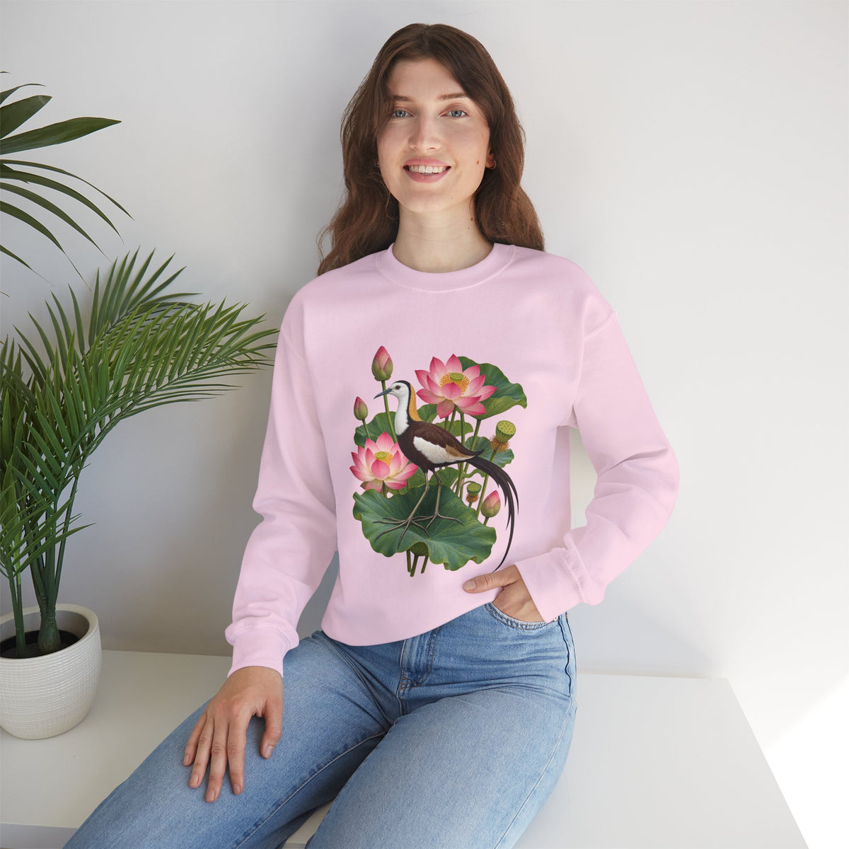 Lightly, She Goes crewneck sweatshirt, a long-tailed waterbird among pink lotus blossoms, buds, seed pods and broad green leaves, image 21 of 28