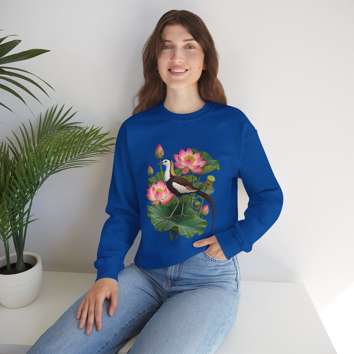 Lightly, She Goes crewneck sweatshirt, a long-tailed waterbird among pink lotus blossoms, buds, seed pods and broad green leaves, image 10 of 28
