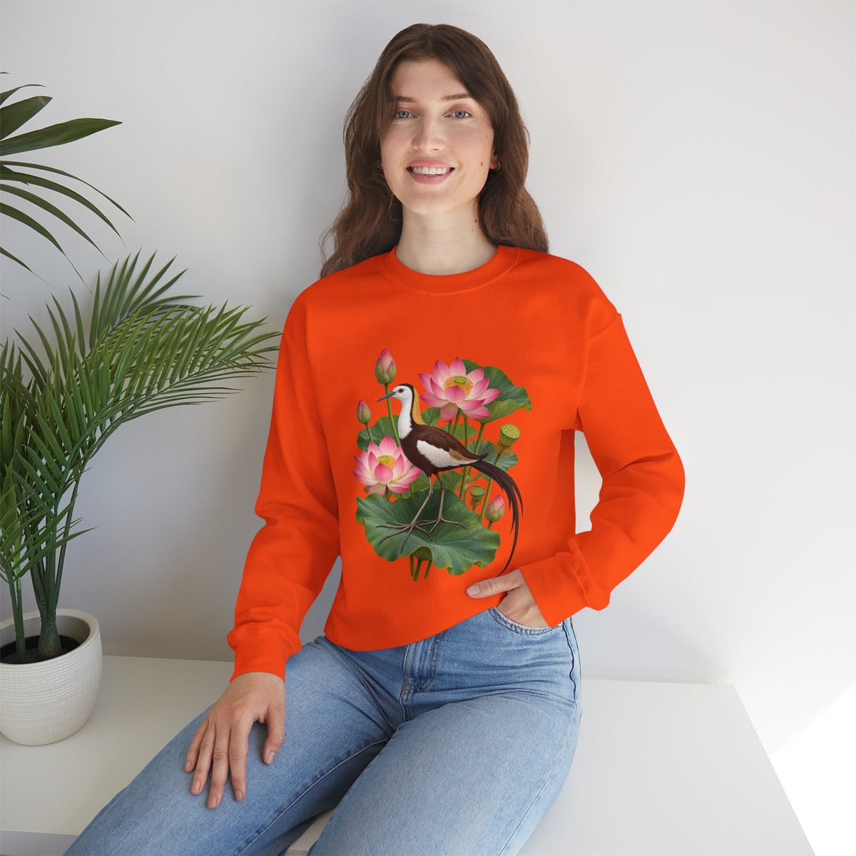 Lightly, She Goes crewneck sweatshirt, a long-tailed waterbird among pink lotus blossoms, buds, seed pods and broad green leaves, image 15 of 28