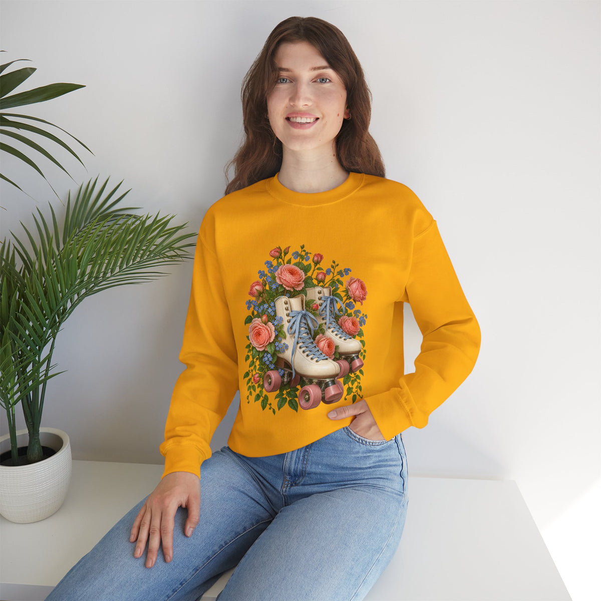 She Still Rolls crewneck sweatshirt, cream roller skates with blue laces and dusty pink wheels among coral roses, small blue flowers and trailing greenery, image 15 of 21