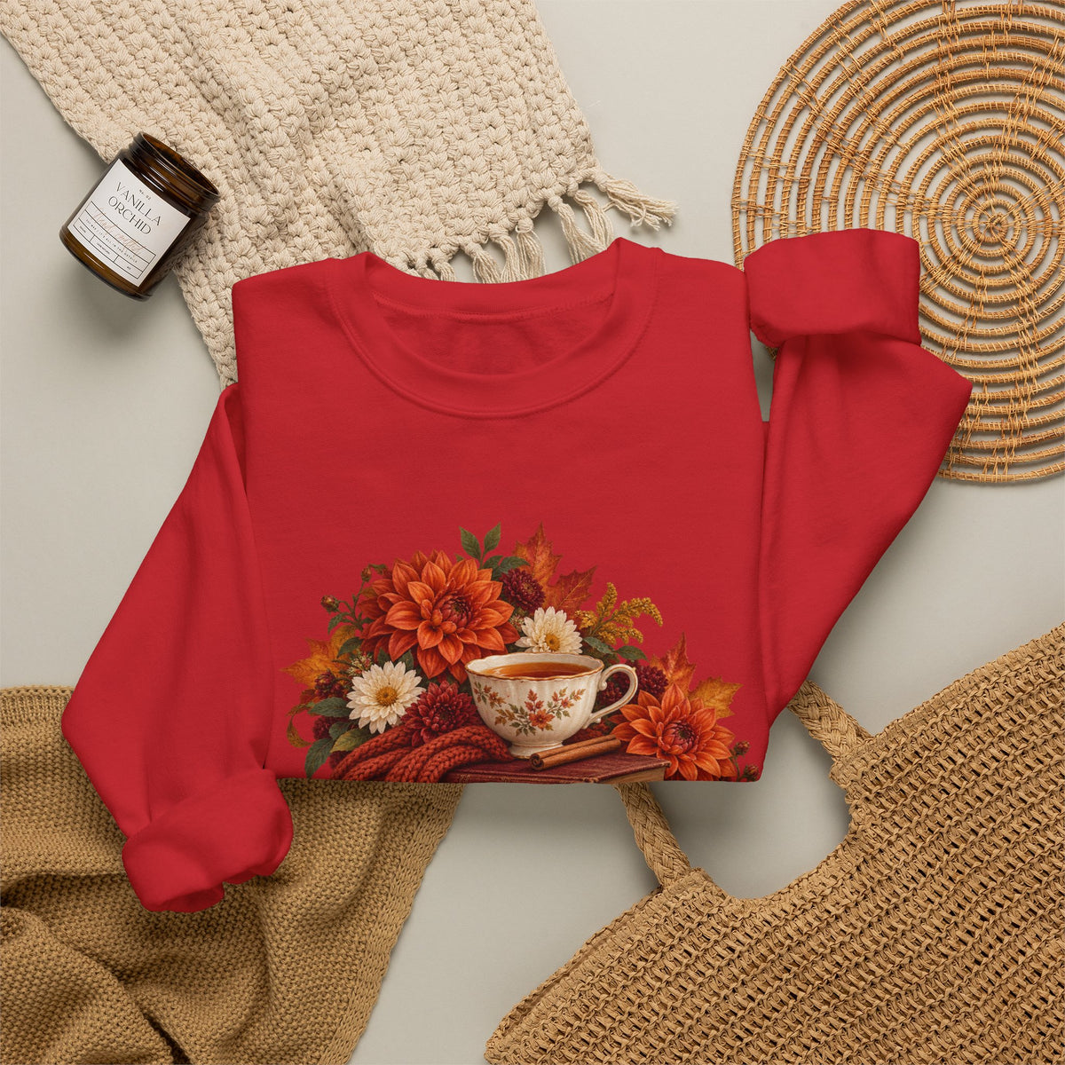 Just One More Chapter crewneck sweatshirt, a floral teacup resting on a stack of vintage books with pears, autumn flowers and a rust-colored scarf, image 10 of 14