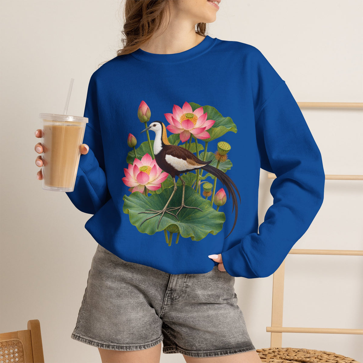 Lightly, She Goes crewneck sweatshirt, a long-tailed waterbird among pink lotus blossoms, buds, seed pods and broad green leaves, image 9 of 28