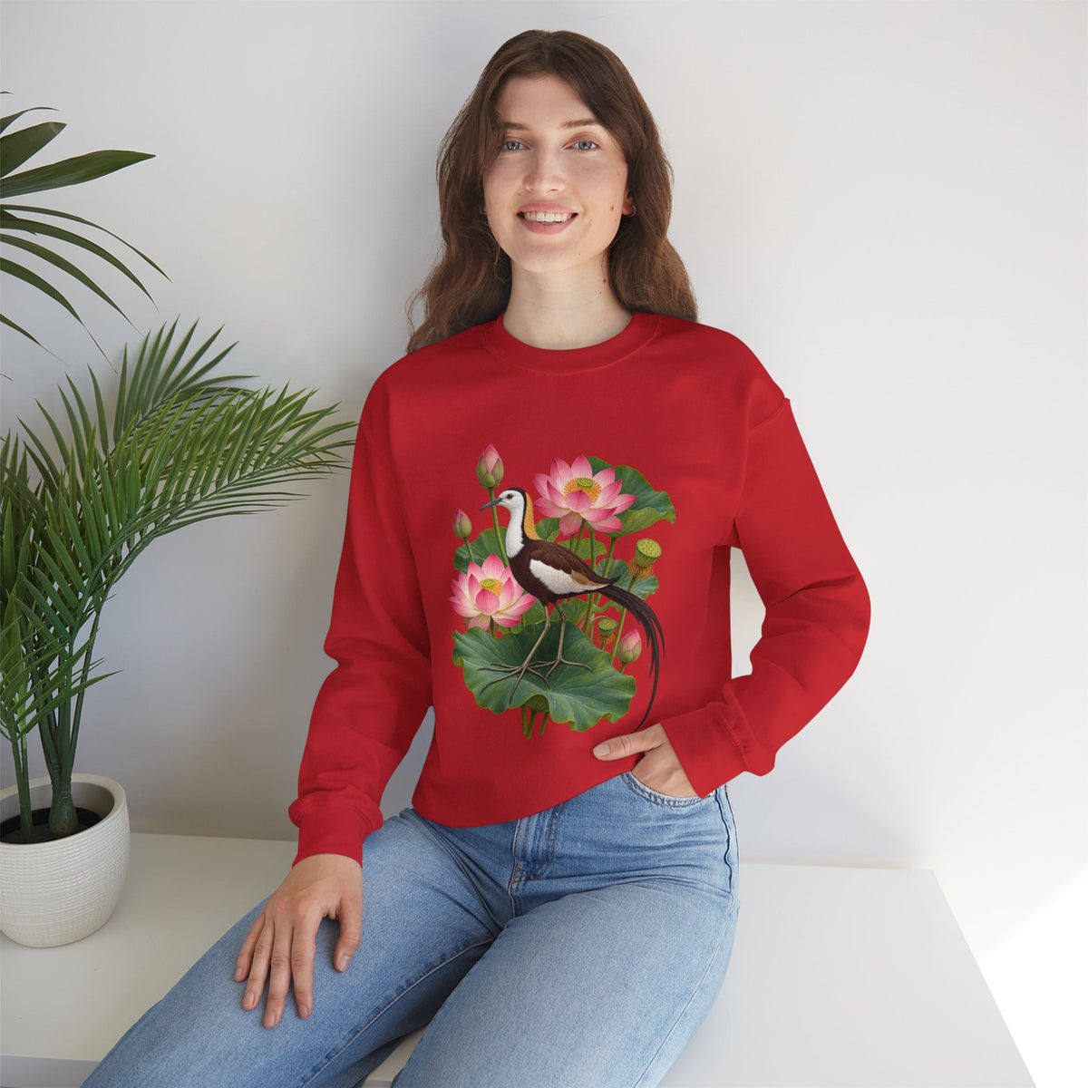 Lightly, She Goes crewneck sweatshirt, a long-tailed waterbird among pink lotus blossoms, buds, seed pods and broad green leaves, image 27 of 28