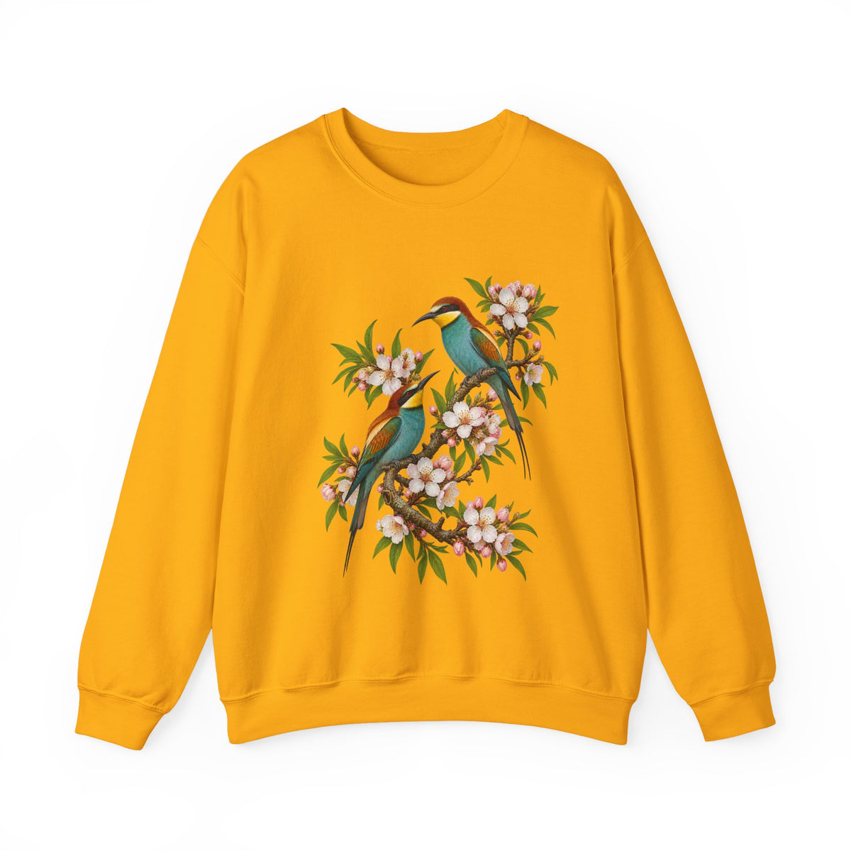The Scenic Way Home sweatshirt — two birds with teal, golden-yellow and rust plumage perched among cream and blush blossoms, on a unisex crewneck