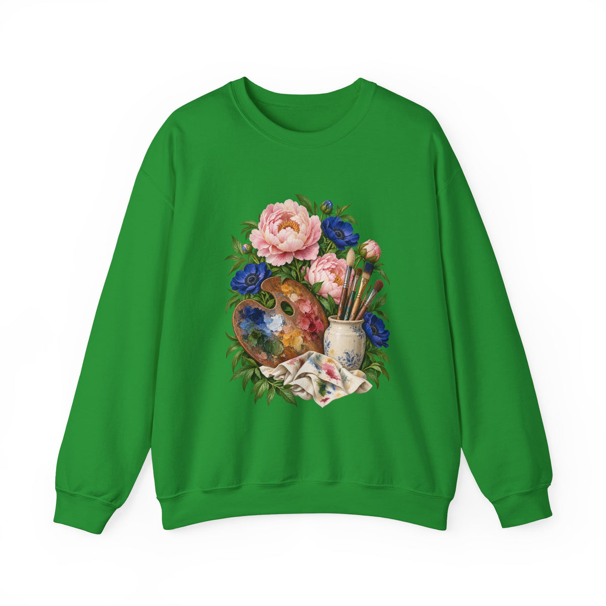 The Colors She Kept crewneck sweatshirt, a paint-covered artist palette beside a cream ceramic jar of brushes with pink peonies and deep blue flowers, image 3 of 28