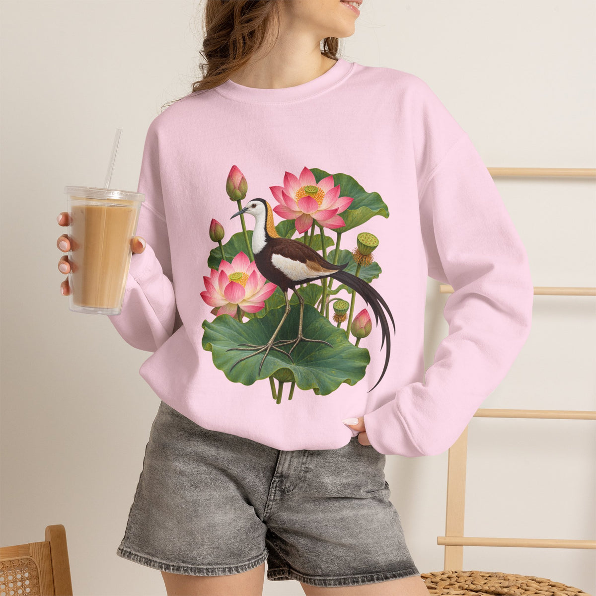 Lightly, She Goes crewneck sweatshirt, a long-tailed waterbird among pink lotus blossoms, buds, seed pods and broad green leaves, image 22 of 28