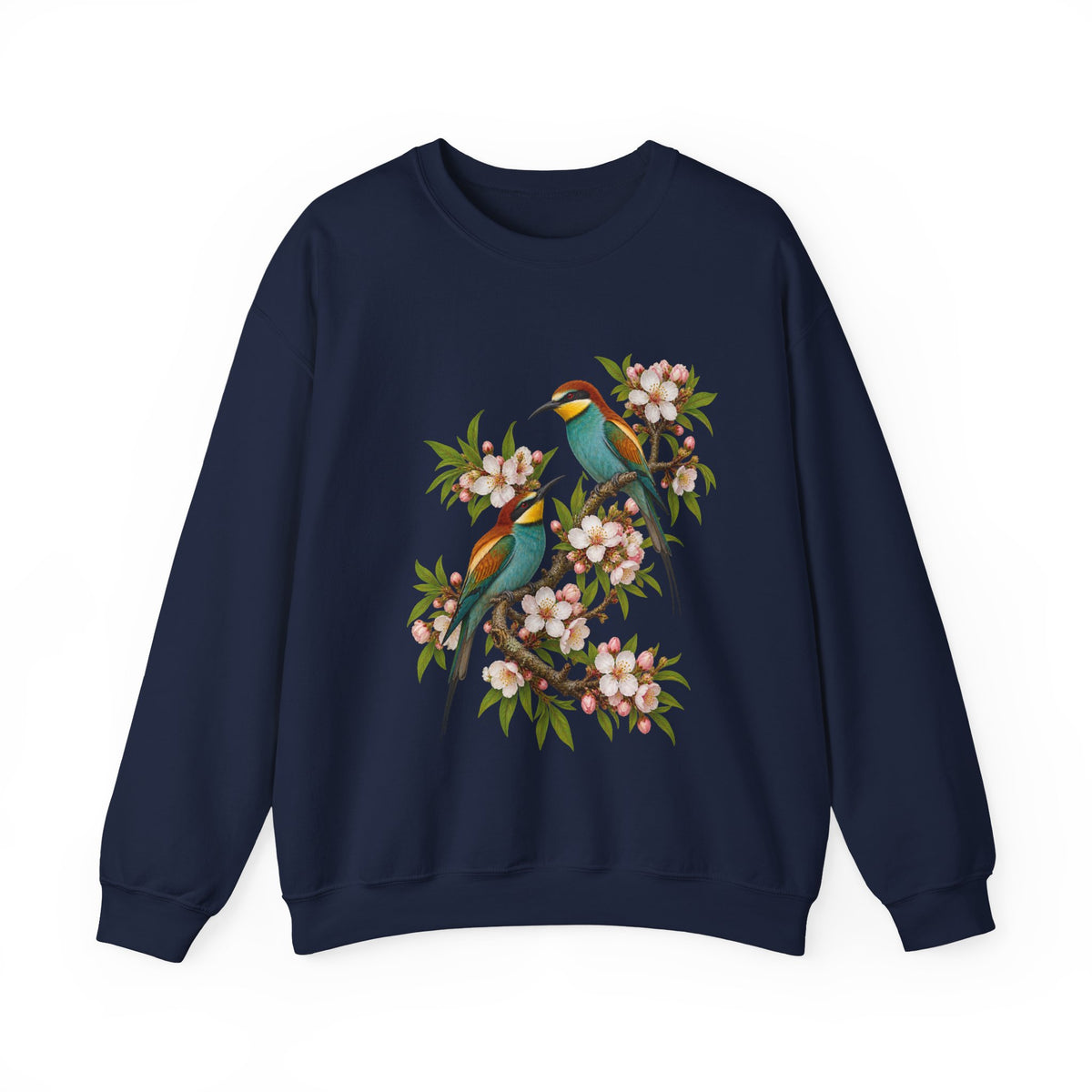 The Scenic Way Home sweatshirt — two birds with teal, golden-yellow and rust plumage perched among cream and blush blossoms, on a unisex crewneck