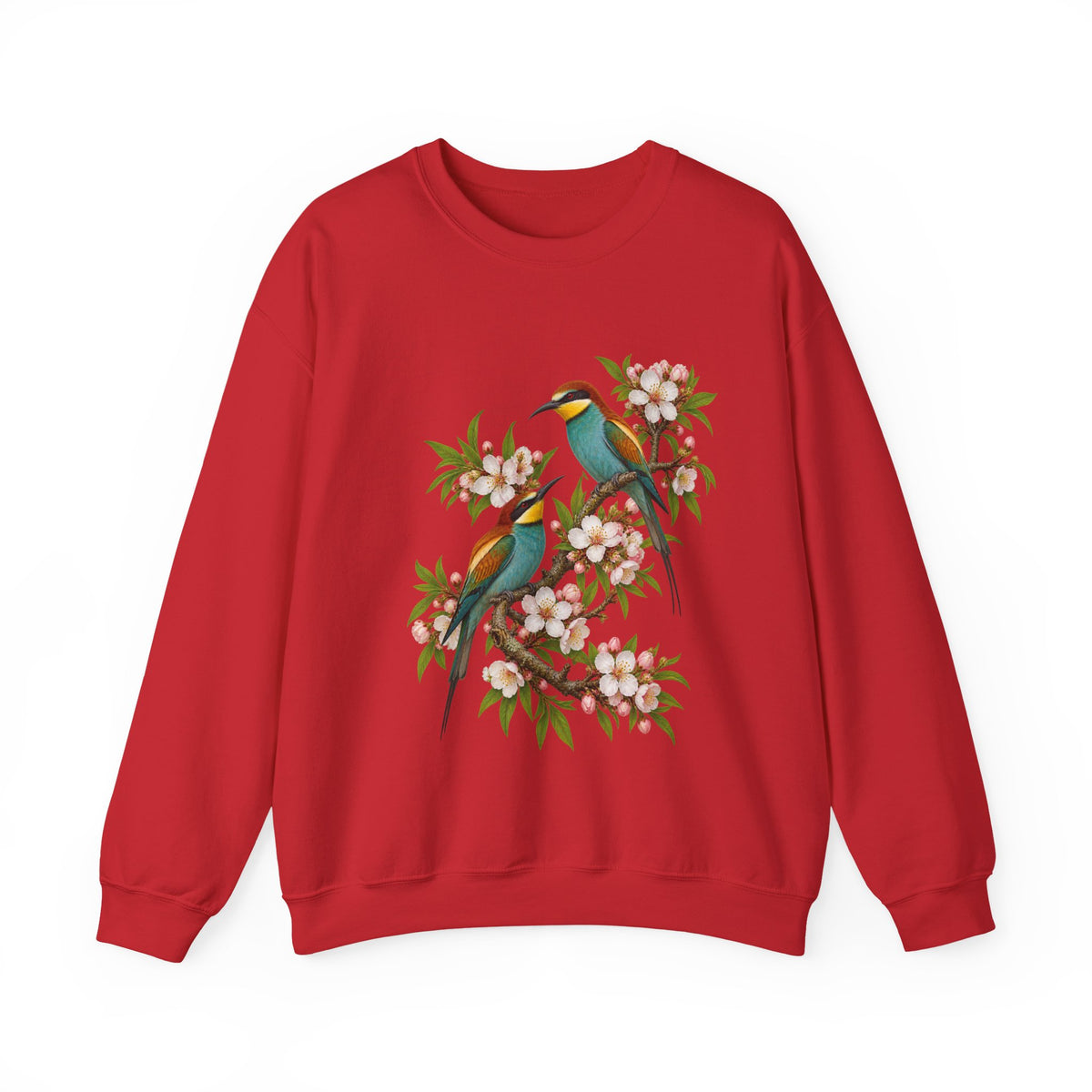 The Scenic Way Home sweatshirt — two birds with teal, golden-yellow and rust plumage perched among cream and blush blossoms, on a unisex crewneck