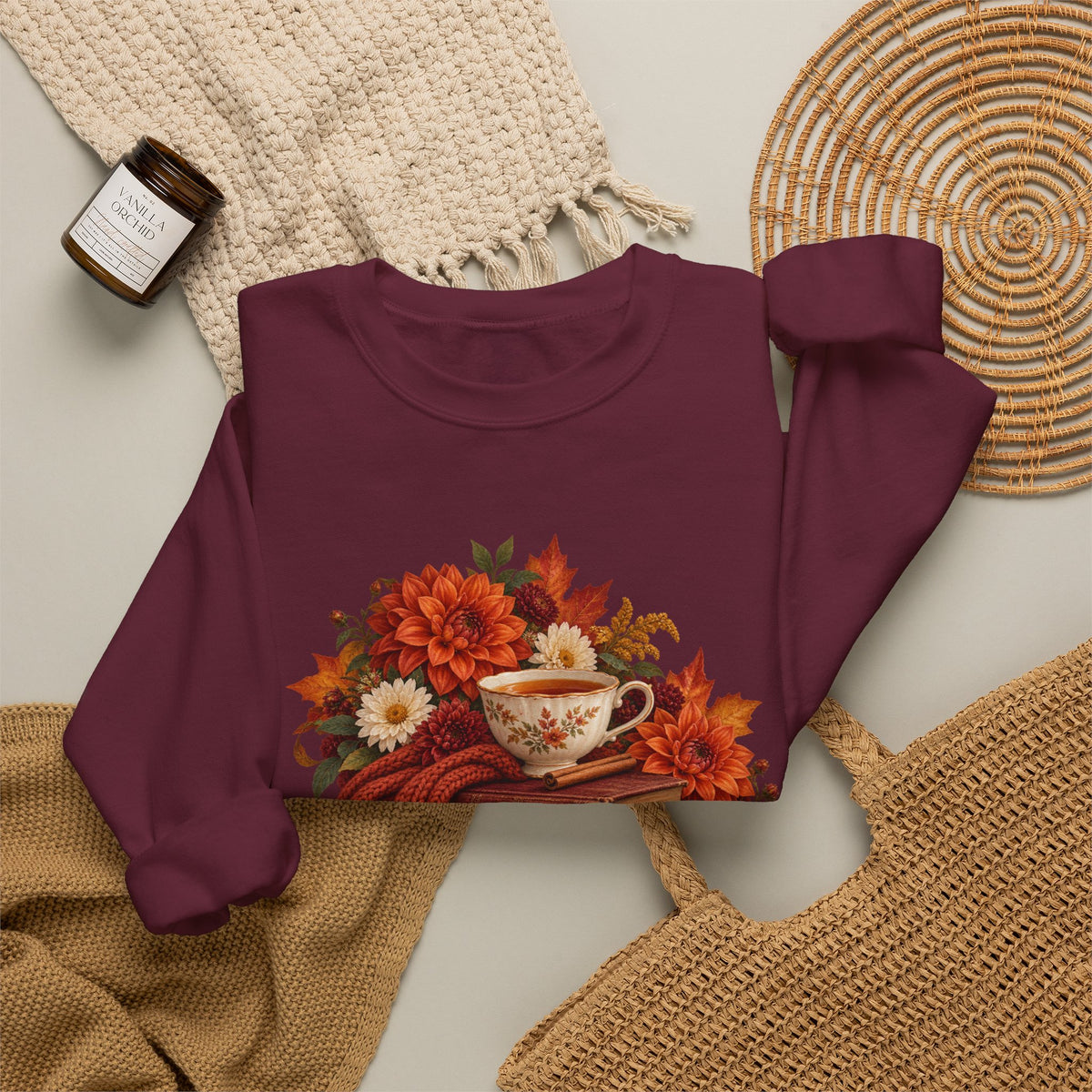 Just One More Chapter crewneck sweatshirt, a floral teacup resting on a stack of vintage books with pears, autumn flowers and a rust-colored scarf, image 9 of 14