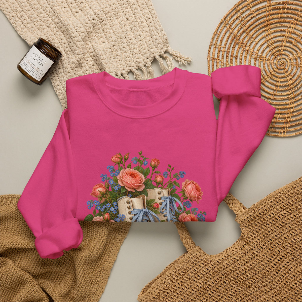 She Still Rolls crewneck sweatshirt, cream roller skates with blue laces and dusty pink wheels among coral roses, small blue flowers and trailing greenery, image 21 of 21