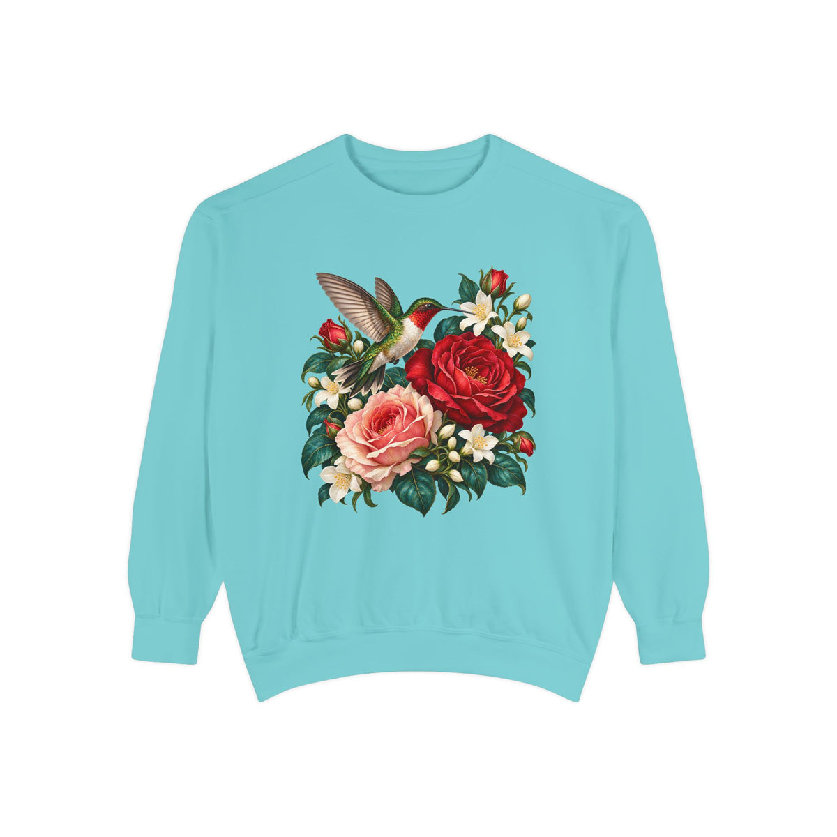 Hummingbird in a hover beside open roses and white jasmine — a printed graphic, not embroidery, on garment-dyed heavyweight fleece