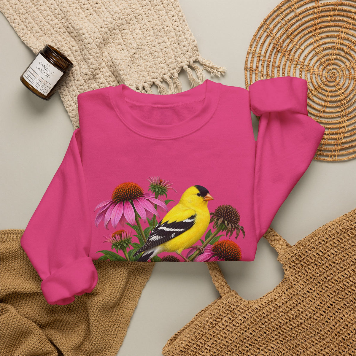 A Small Bright Thing crewneck sweatshirt, a golden-yellow American goldfinch among pink coneflowers, seed heads and green leaves, image 12 of 22
