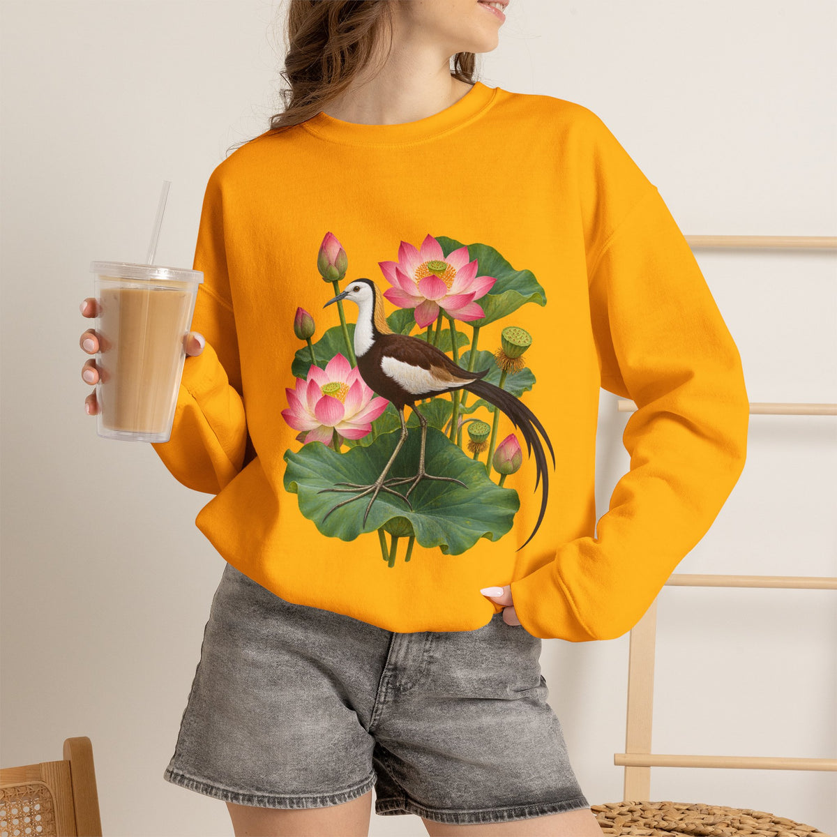 Lightly, She Goes crewneck sweatshirt, a long-tailed waterbird among pink lotus blossoms, buds, seed pods and broad green leaves, image 13 of 28