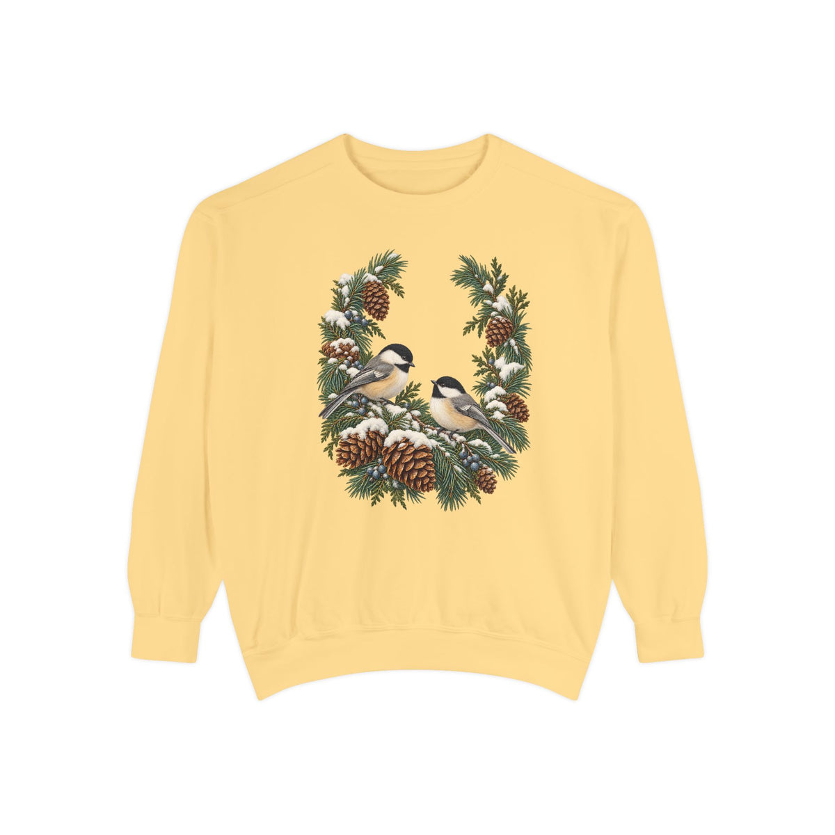 Chickadee Christmas sweatshirt in Butter, a pale yellow garment-dyed Comfort Colors 1566 crewneck with two chickadees in a pinecone wreath