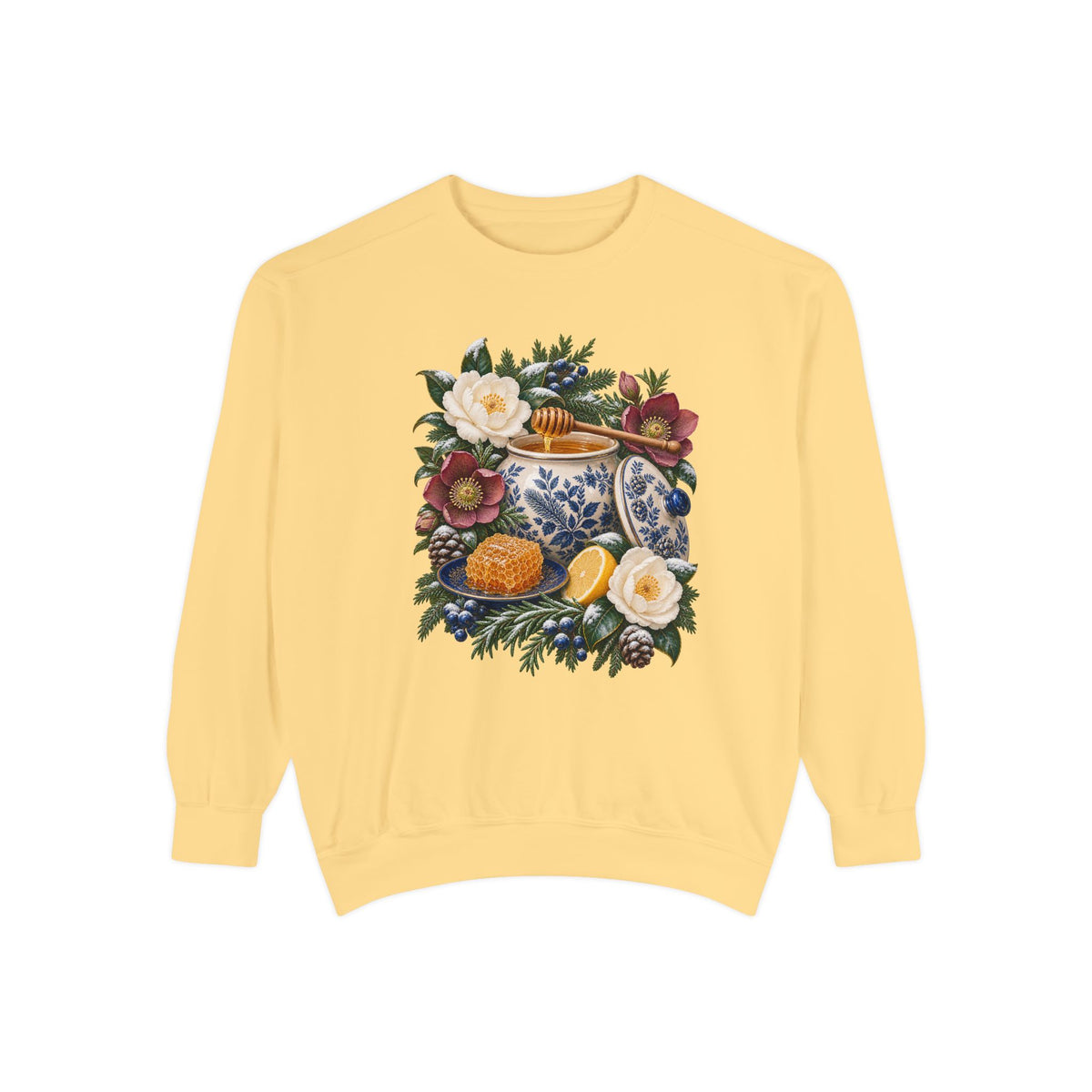 Transferware jar, dipper and cut lemon printed straight onto the garment color with no panel behind the artwork — a cream and cobalt transferware jar of honey with a wooden dipper, honeycomb on a blue plate and a cut lemon among winter florals