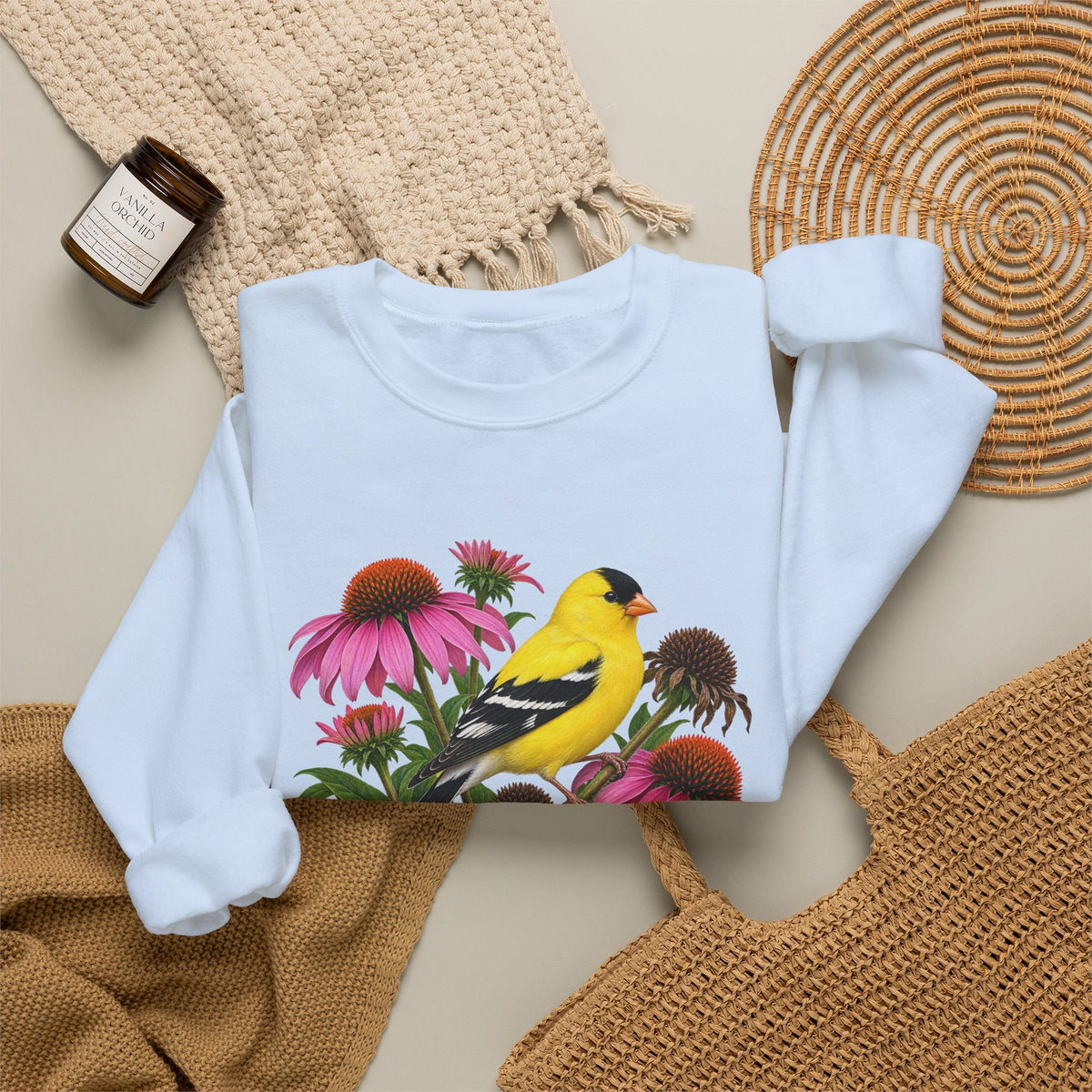 A Small Bright Thing crewneck sweatshirt, a golden-yellow American goldfinch among pink coneflowers, seed heads and green leaves, image 17 of 22