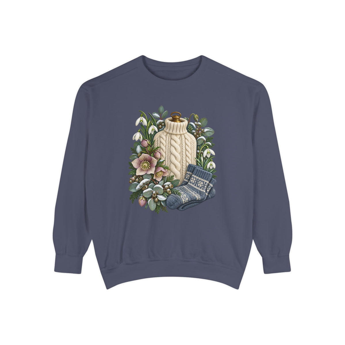 Winter still-life print, relaxed unisex crewneck, adult sizes S to 3XL - a cream cable-knit bottle cover standing among white snowdrops, pink hellebores, folded blue patterned socks and snow-dusted evergreen