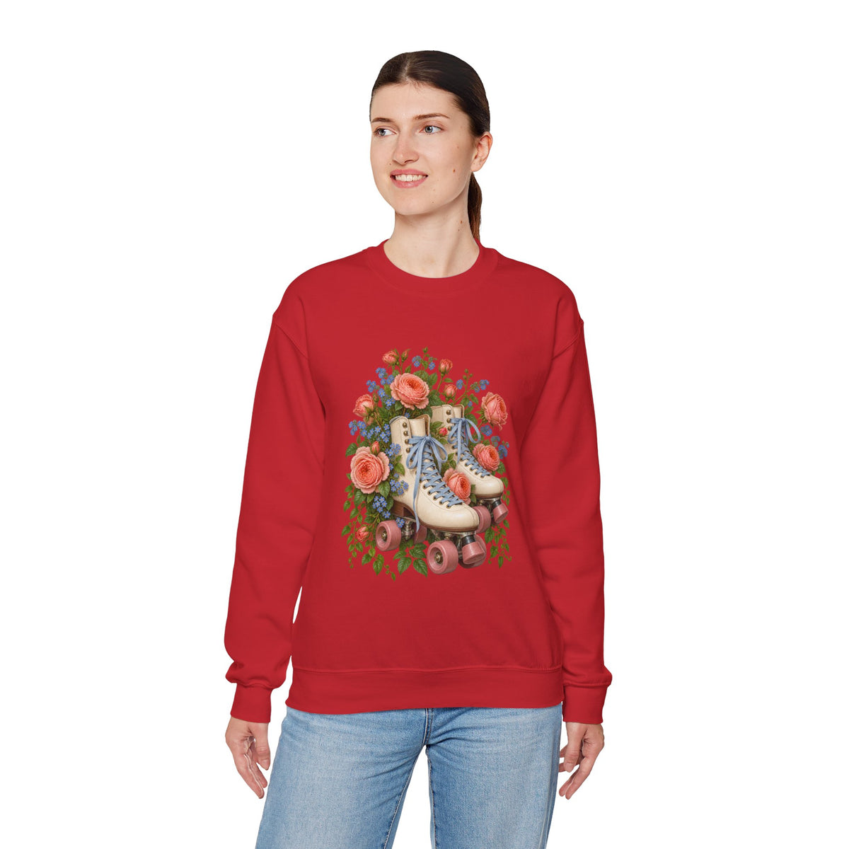 She Still Rolls crewneck sweatshirt, cream roller skates with blue laces and dusty pink wheels among coral roses, small blue flowers and trailing greenery, image 13 of 21