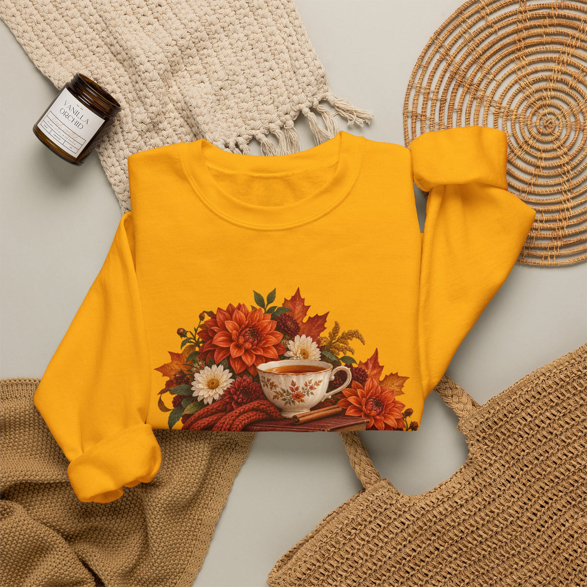 Just One More Chapter crewneck sweatshirt, a floral teacup resting on a stack of vintage books with pears, autumn flowers and a rust-colored scarf, image 11 of 14