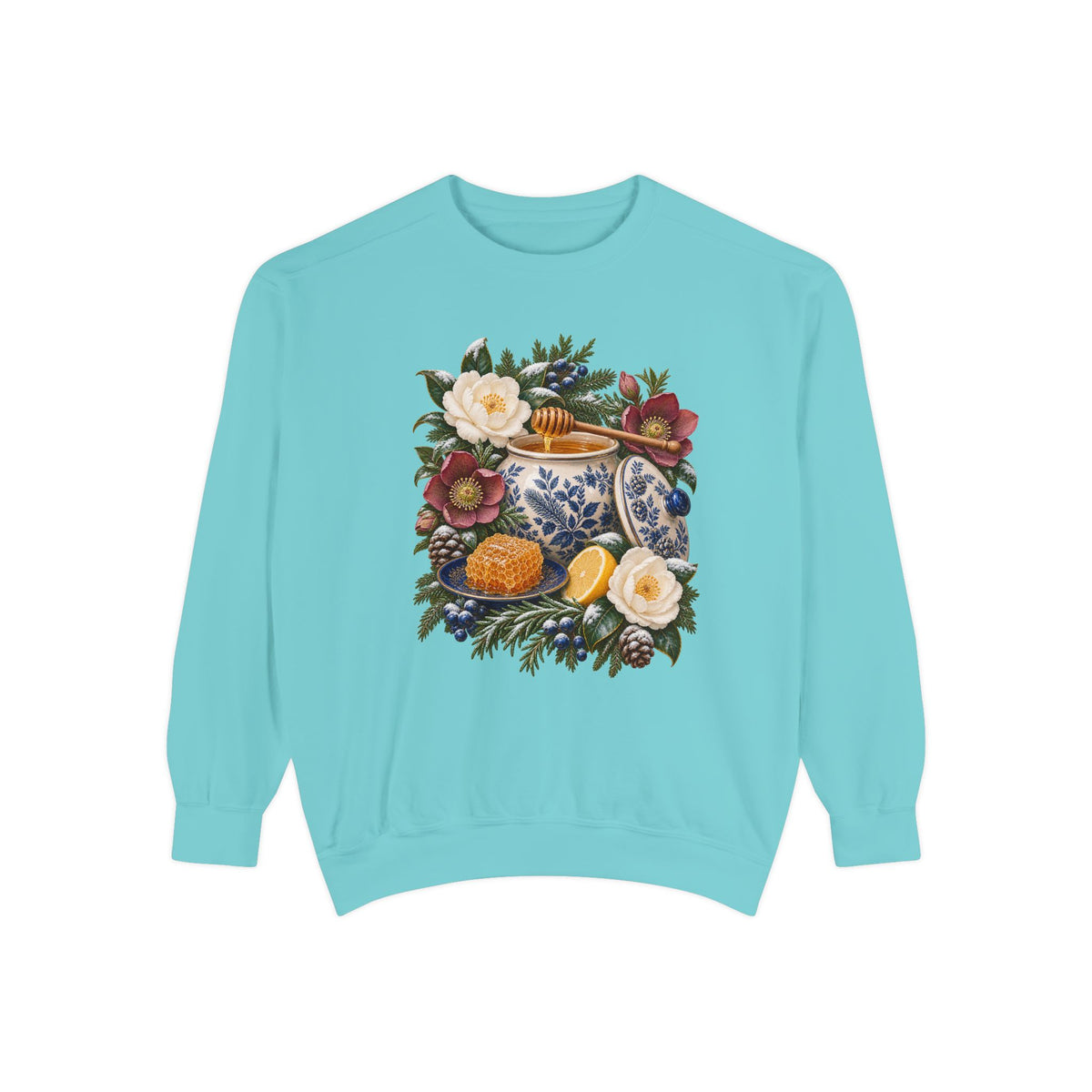 Gift sweatshirt for lovers of blue and white china, garment-dyed heavyweight fleece, made to order — a cream and cobalt transferware jar of honey with a wooden dipper, honeycomb on a blue plate and a cut lemon among winter florals