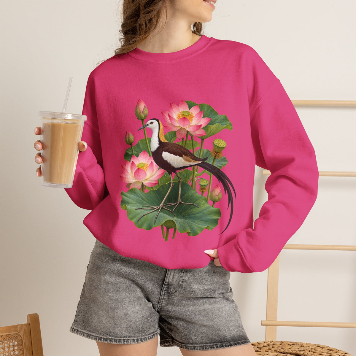 Lightly, She Goes crewneck sweatshirt, a long-tailed waterbird among pink lotus blossoms, buds, seed pods and broad green leaves, image 25 of 28