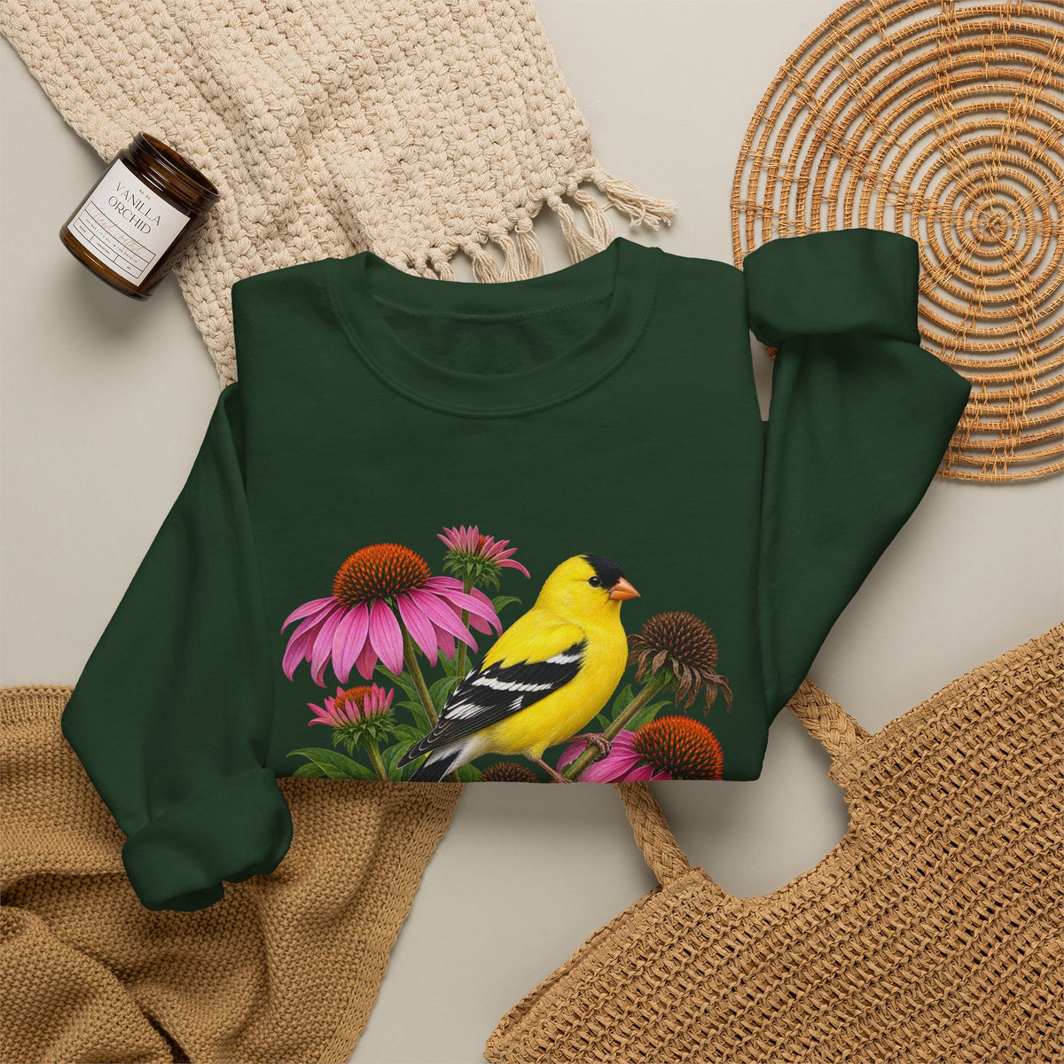A Small Bright Thing crewneck sweatshirt, a golden-yellow American goldfinch among pink coneflowers, seed heads and green leaves, image 9 of 22