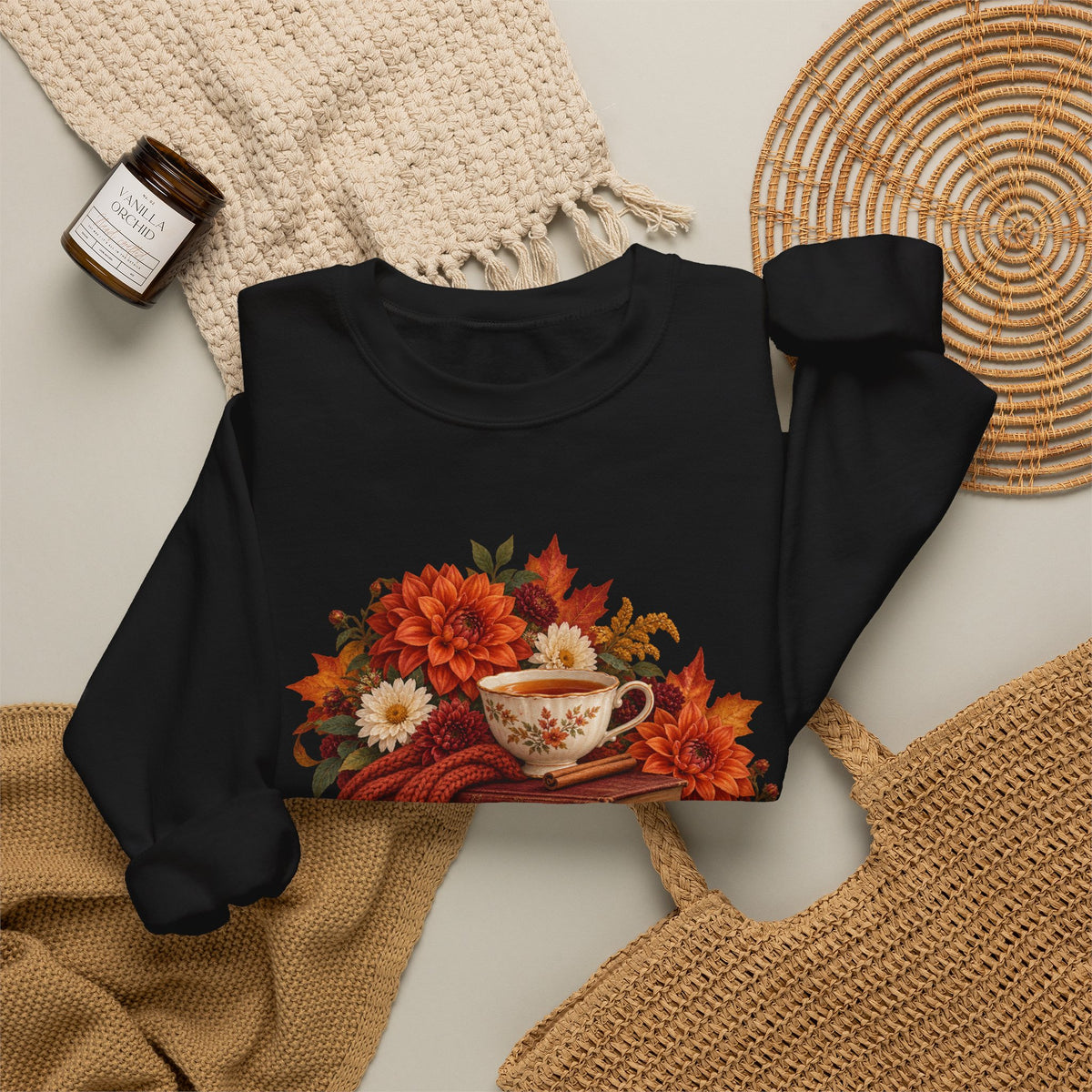 Just One More Chapter crewneck sweatshirt, a floral teacup resting on a stack of vintage books with pears, autumn flowers and a rust-colored scarf, image 8 of 14