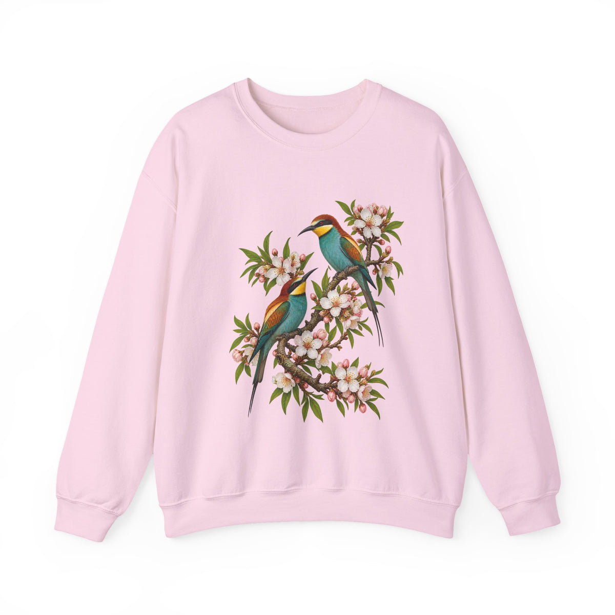 The Scenic Way Home sweatshirt — two birds with teal, golden-yellow and rust plumage perched among cream and blush blossoms, on a unisex crewneck