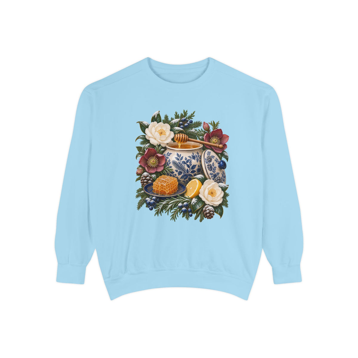 Winter still life shown large and centered on the chest, not a back print — a cream and cobalt transferware jar of honey with a wooden dipper, honeycomb on a blue plate and a cut lemon among winter florals