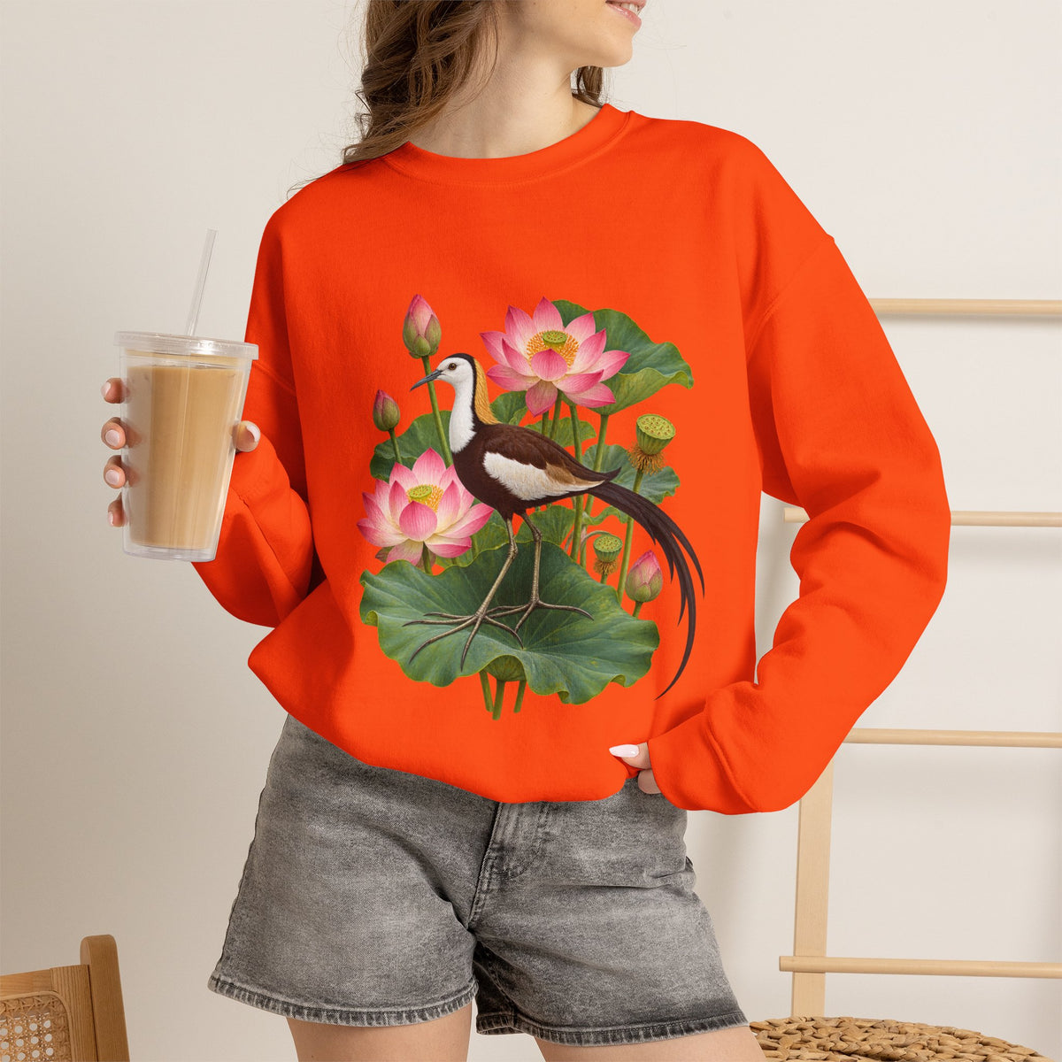 Lightly, She Goes crewneck sweatshirt, a long-tailed waterbird among pink lotus blossoms, buds, seed pods and broad green leaves, image 16 of 28