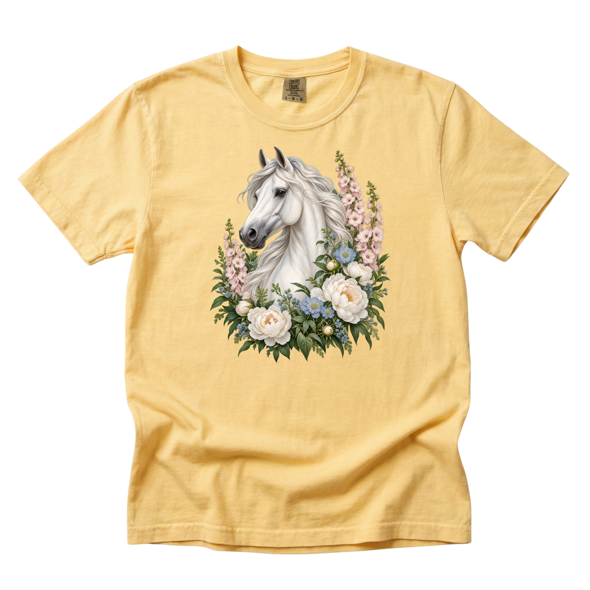A Grace of Her Own premium tee in Butter, a white horse with pale blue and pink flowers