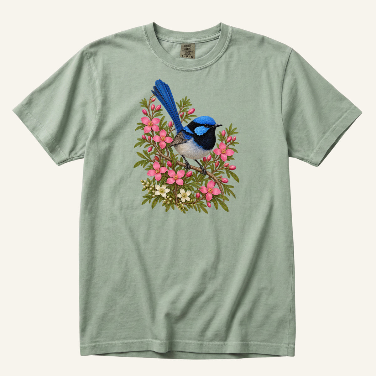 Small blue and black bird with an upright tail among pink blossoms and cream flowers, printed on a Bay sea green Comfort Colors 1717 unisex t-shirt