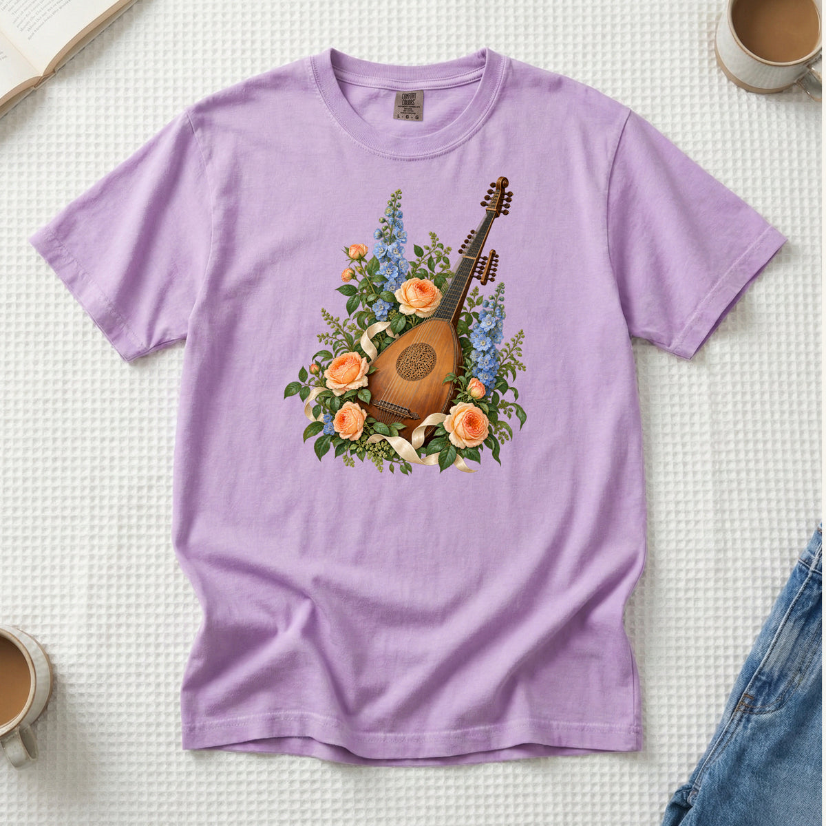 Vintage wooden lute with a carved rose sound hole among apricot roses and tall blue blossoms, printed on an Orchid lavender Comfort Colors 1717 unisex t-shirt