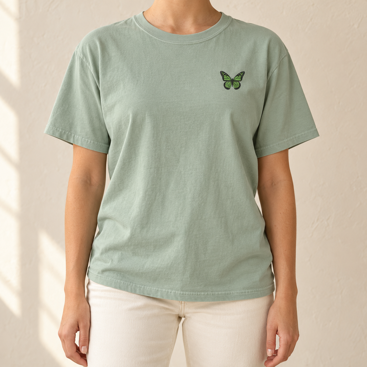 Monarch Butterfly Front and Back T-Shirt in Bay sage green, front view - small monarch at the chest
