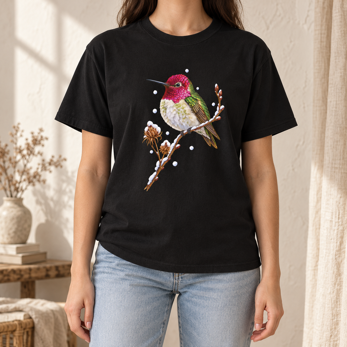 Winter Hummingbird T-Shirt in Black - a watercolor Anna's hummingbird with a magenta head perched on a snowy twig, printed on a garment-dyed Comfort Colors 1717 cotton tee