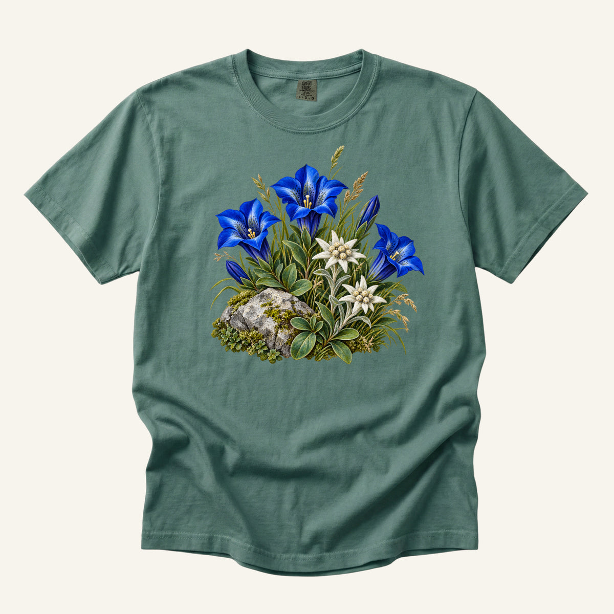 Blue Gentian & Edelweiss T-Shirt in Light Green — cobalt-blue gentians and star-shaped white edelweiss beside a moss-covered stone