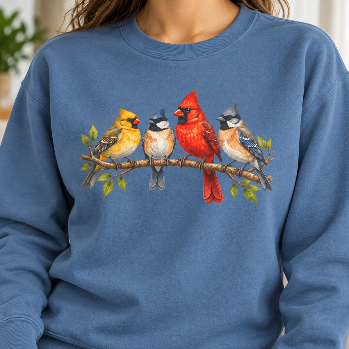 Blue Jean sweatshirt with four-bird artwork - Four Colorful Songbirds on a Leafy Branch Sweatshirt worn indoors